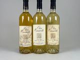 three bottles of wine sitting next to each other on a table