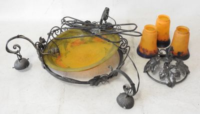 a bowl with candles and a candle holder on the table