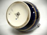 a blue and white vase with a horse on it