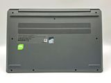 a close up of a laptop with a green sticker on it