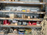 many different types of tools on the shelves in the garage