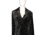 the mannequin is wearing a black jacket and white pants