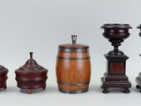 several different types of wooden vases and containers on a white surface