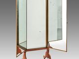 an old fashioned mirrored cabinet with a mirror on top of it