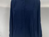 a close up of a mannequin with a blue shirt on it