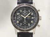 a close up of a watch on a white background