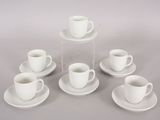 six cups and saucers sitting on a table