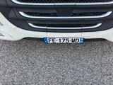 a close up of the front of a black and white truck