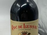 an image of a bottle of wine sitting on a table