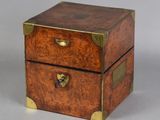 an image of a small wooden box with two drawers