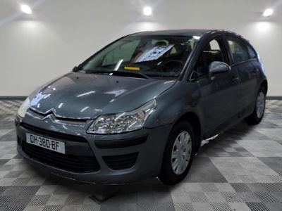 a picture of a grey car in a showroom