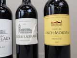three bottles of wine sitting next to each other on a table