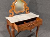 a wooden vanity with a marble top and a mirror