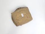 a piece of wood that has a tag on it