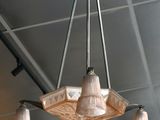a chandelier hanging from the ceiling in a restaurant