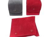 a set of three red and grey sued pouchs