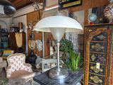 a lamp that is sitting on top of a table in a room