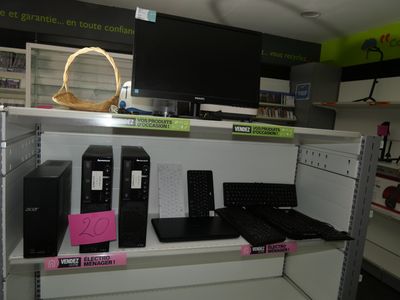 a lot of computer equipment on the shelves in the store