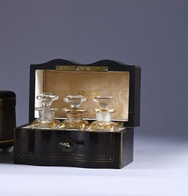 a small black box with a set of glassware in it