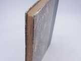 a book that is open on a white surface