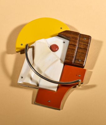 a banana and a banana peeler on a wall