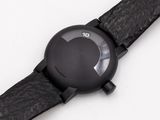 the watch has a black leather band and a black dial
