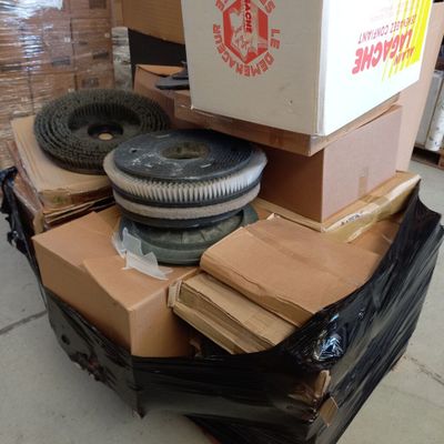 a pile of boxes and a box of tires on a cart