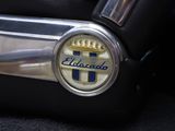 a close up of the emblem on a car ' s steering wheel