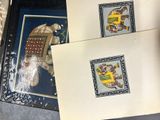 two cards with pictures of animals on them on a table