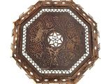 an image of a decorative wooden table top with a circular design