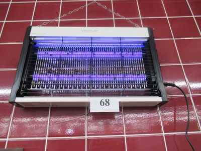a purple light in the middle of a black and white heater
