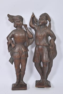 paire de figurines anciennes en bronze représentant un homme et une femme