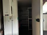 a kitchen with a stove and a refrigerator in it