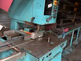 an image of a machine that is working on a piece of metal