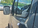 a car that is parked in a lot with other cars