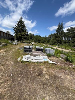 a lot of trash in the middle of a field