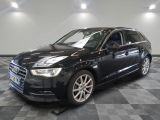 an image of a black audi suv parked in a garage