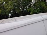 a white van that is parked on the side of the road