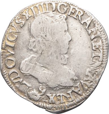 une pièce d'argent portant l'image d'un homme