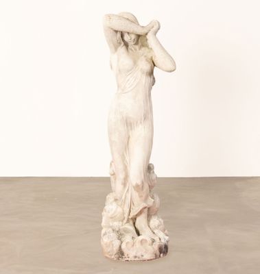 statue of a woman with a hat on her head
