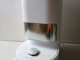 a water dispenser sitting on top of a counter