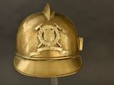 a gold helmet with a coat of arms on it