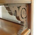 a wooden shelf with a clock on top of it