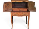 an old wooden desk with a drawer and two doors open