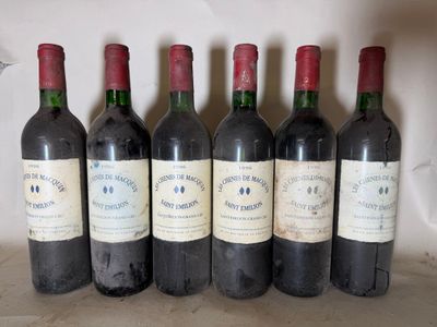 six bottles of wine are lined up in a row on a counter