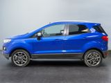 the blue ford eco - pace suv is parked in a showroom