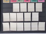 a picture of a display of postage stamps on a black board