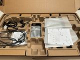 a box with a phone inside of it on a table
