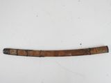 an old wooden stick with a metal handle on a white surface