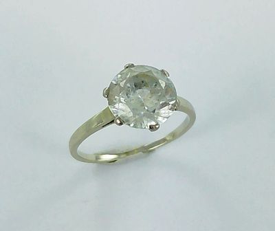 an image of a diamond ring on a white surface
